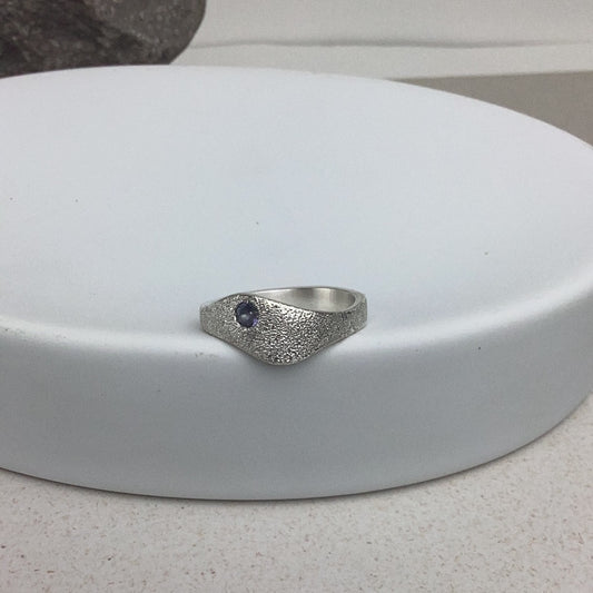 Sea to sky ring with pebble texture and stone